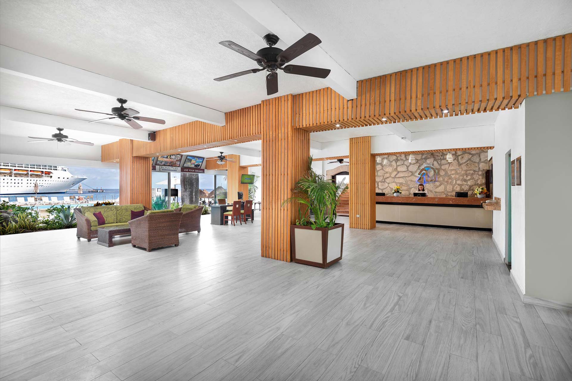 Resort lobby with black fans and open concept space